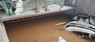 Oficina mecânica teve o estoque de peças submerso pela água da chuva em Passo Fundo - Foto: Kleiton Vasconcellos/ON